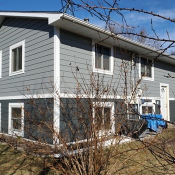 What Causes Moisture to Get Trapped Behind Siding, and How Can It Be Prevented?
