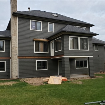 How Often Should Exterior Components Like Flashing, Caulking, and Trim Be Inspected or Replaced?